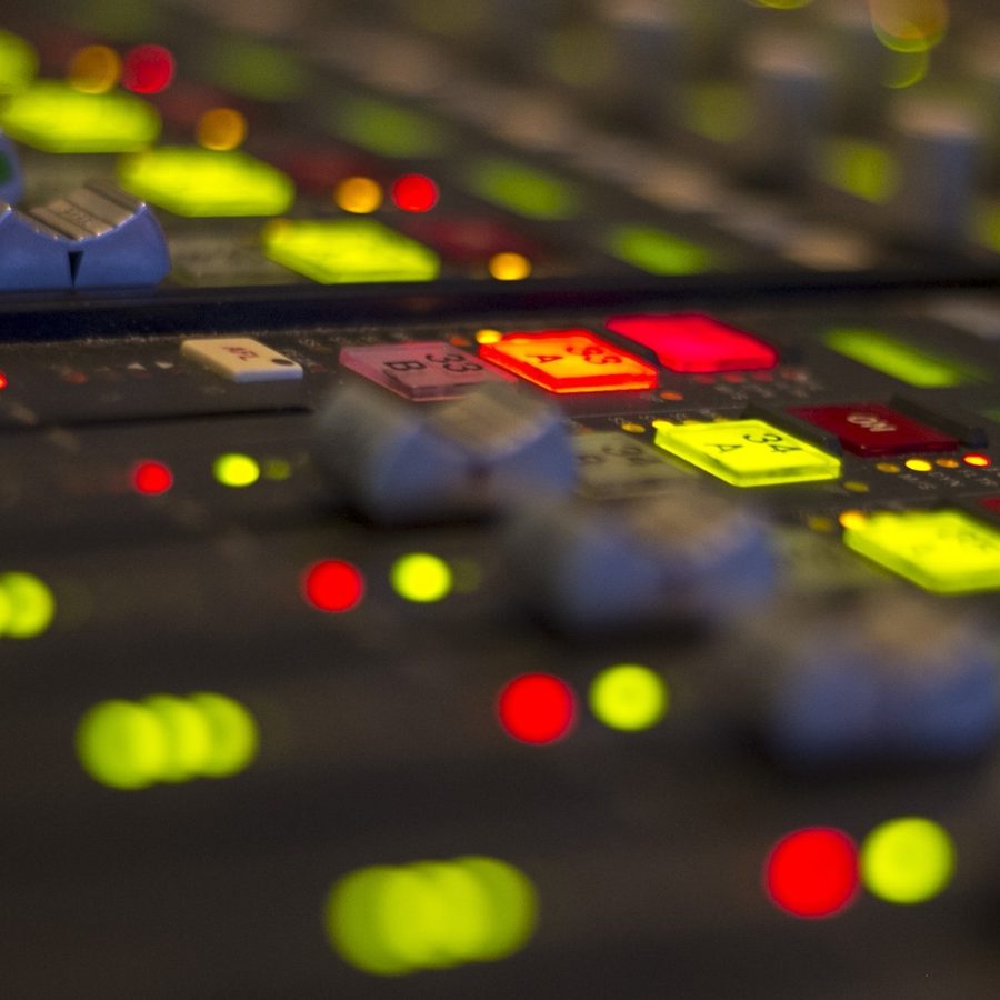 Faders on a mixing desk