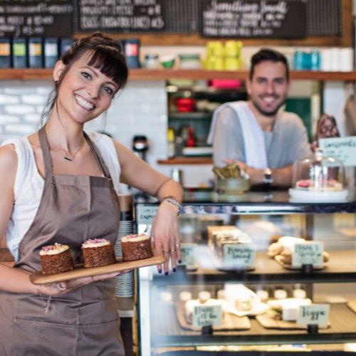 Small business owners in their cafe